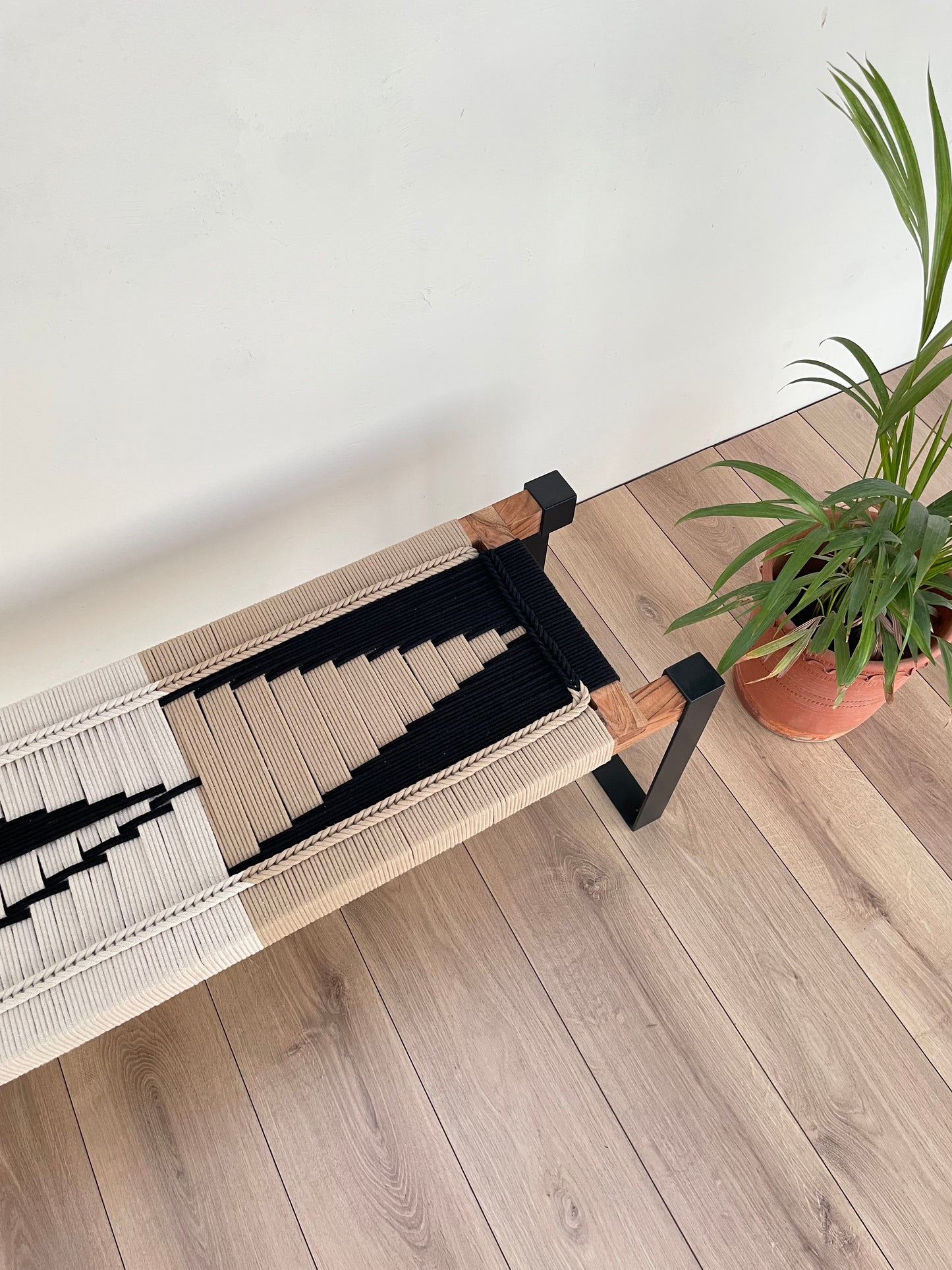 Draco woven bench in black metal legs